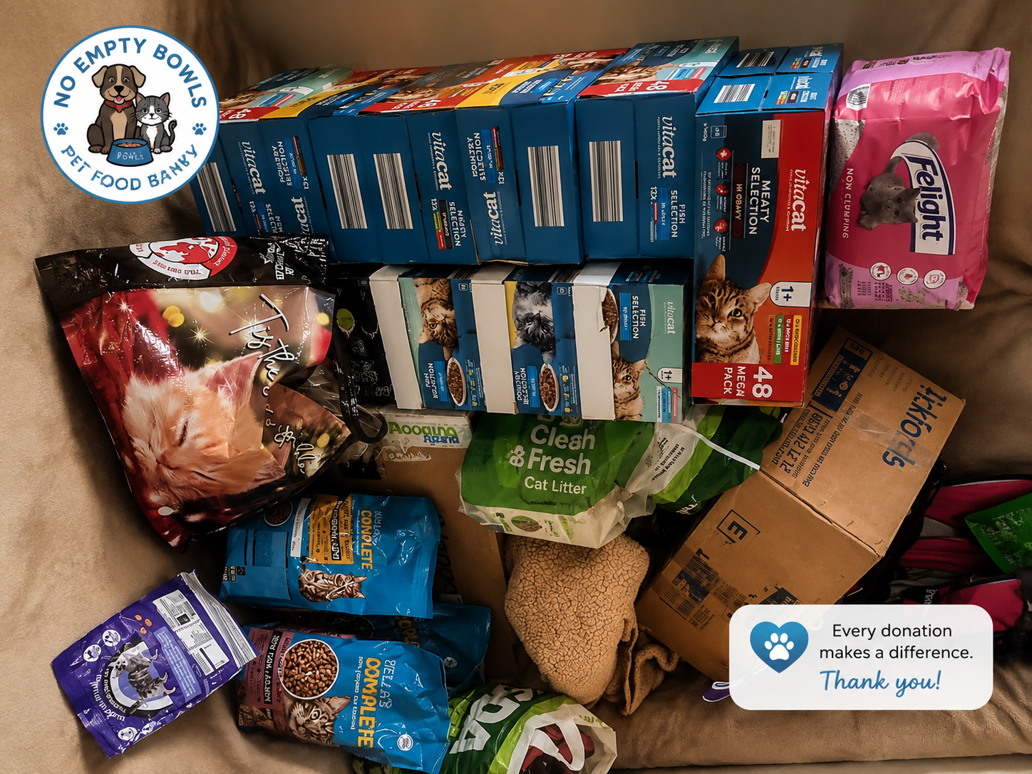 Boxes and bags of donated cat food and litter